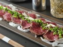 Private Room Yakiniku Wagyu Horumon Isshin_"Specially selected beef TATAKI wrapped in sliced garlic and served with homemade ponzu sauce"