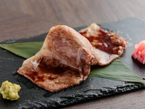  "Wagyu Sirloin Grilled Sushi (1 piece)" - a harmonious blend of meaty flavor and rice 