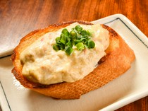 Kachaguriya_Crab toast (Garlic toast with crab meat) - The toast's crispy texture and the crab's flavor melt together.