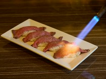 La Veranda APA Hotel & Resort Tokyo Bay Makuhari_Aburizushi - The final touch is seared in front of the guests.