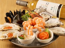  The "Seafood Platter" is packed with fresh seafood, with a focus on raw oysters. 