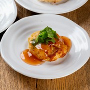 Homemade chicken meatballs topped with plum paste and shiso leaves