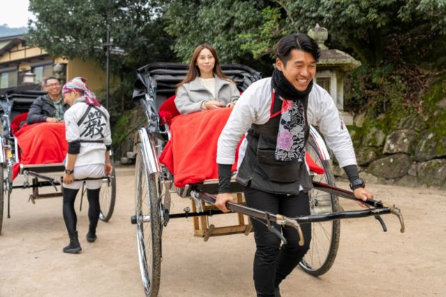 Strolling aroundMiyajima Island in a rickshaw