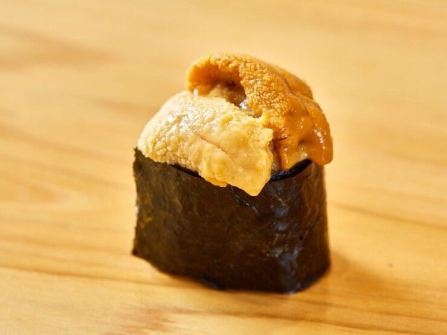 Experience traditional and innovative Edomae sushi in a serene Japanese ambiance.
