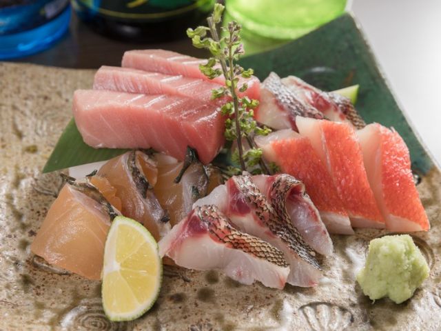 Indulge in Okinawa's unique Ryukyu sushi and specialty dishes, accompanied by delicious Japanese sake and awamori.