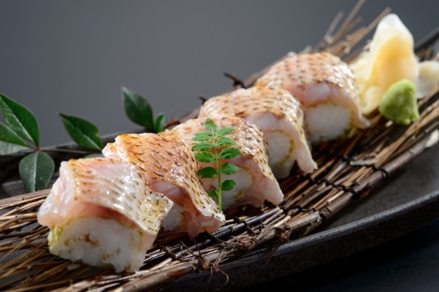 Dine on the top floor of a hotel with a view of a Japanese garden