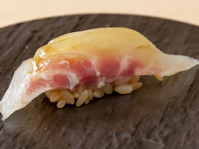 Enjoy affordable sushi that uses a secret red vinegar