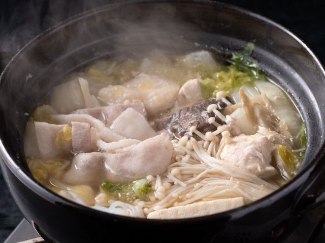Savoring authentic chanko nabe made by former Sumo wrestlers.