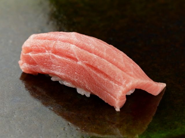 Savor authentic Edomae sushi slowly at the elegant 8-seat counter.