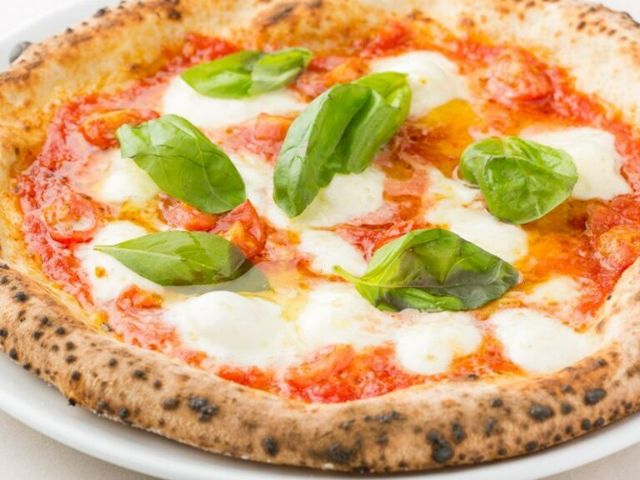 Experience bliss with authentic pizza and a wide selection of wine.