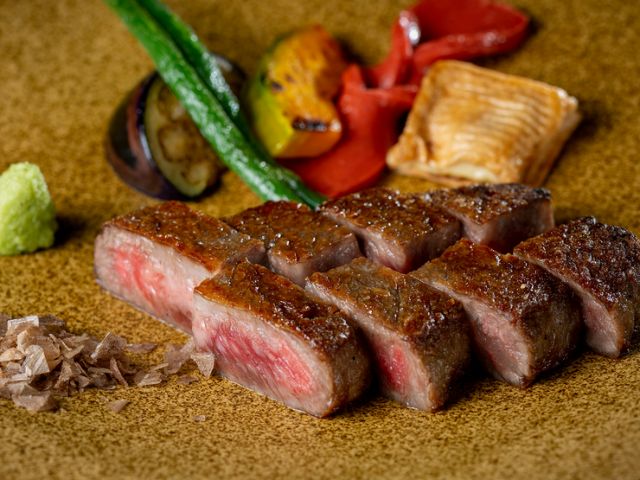 Savoring exquisite Omi beef on the top floor of the hotel.