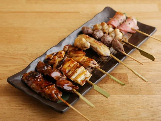 Toast with dishes made from fresh branded chicken and local Fushimi sake